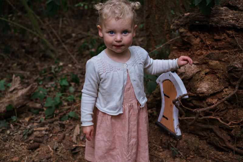 Emilia from Backyard Travel Family is particularly pleased with her fairy door find in McHughs Forest, Darfield, Canterbury, Selwyn District, New Zelaand