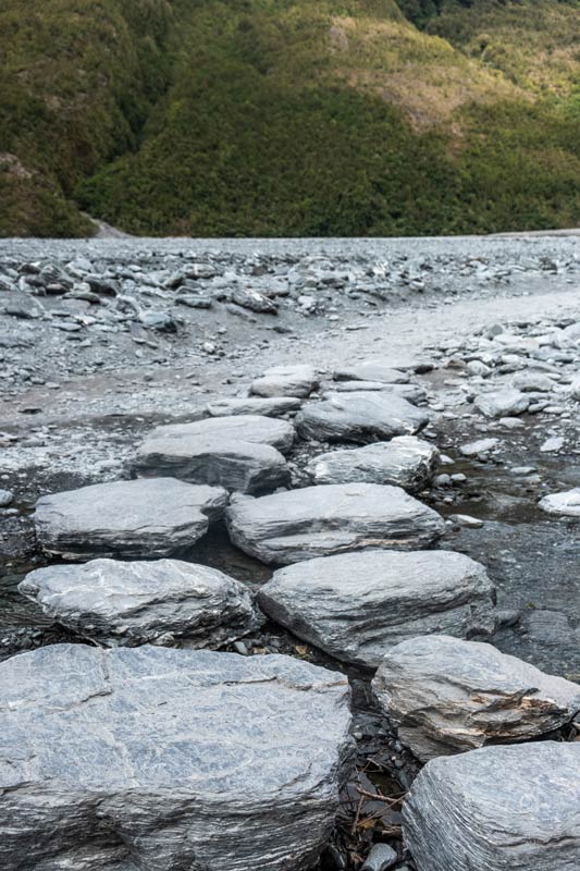 Large stepping stones to cross the river on the walk to Franz Josef Glacier. One of best things to do on the West Coast