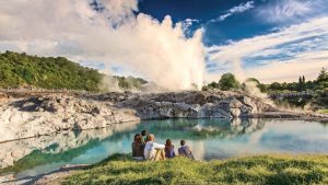 Family watch the steam and geyser at Te Puia Geothermal Valley in Rotorua