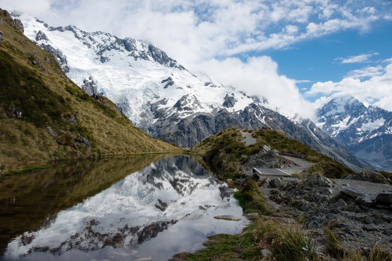 The beautiful but little Sealy Tarn, a little alpine lake, reflecting the snowing mountains in its waters