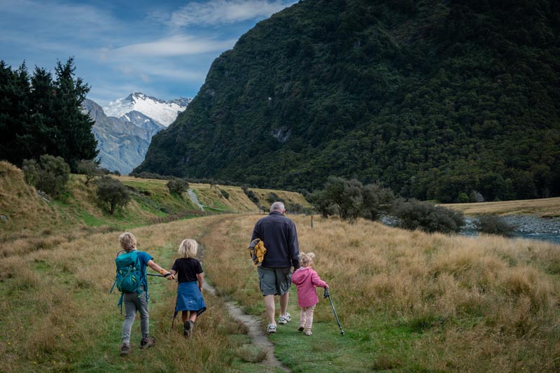 Grandad and three grandchildren begin the 11km Rob Roy Glacier Hike in the Matukituki Valley Lake Wanaka