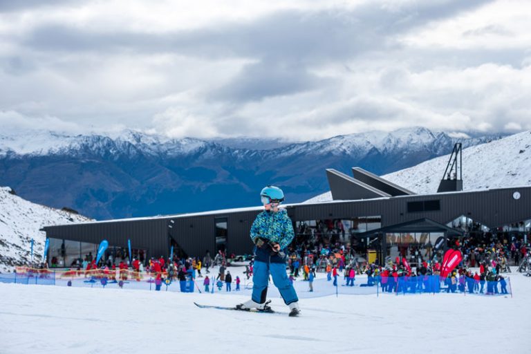 Nathan wears blue Therm ski gear at the Remarkables in Queenstown