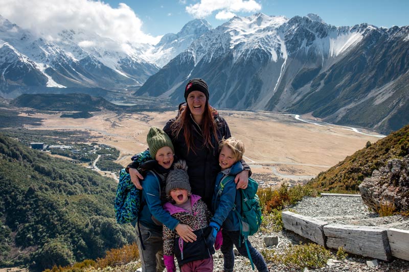 Backyard Travel Family smile in elation as they make it to the Red Tarns Track viewpoint