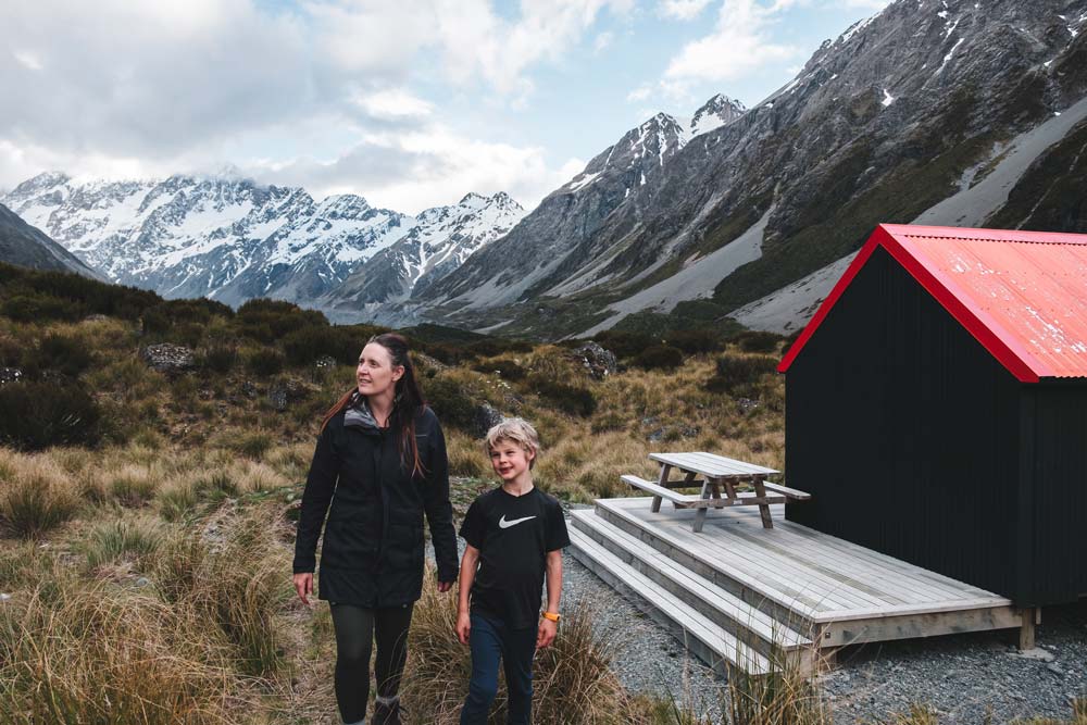 Nathan and Jen from Backyard Travel Family explore the surrounds of the Hooker Hut at Mt Cook