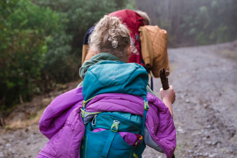 close up of Emilias bag and jacket on her back, hiking up the Mt Fyffe Kaikoura track